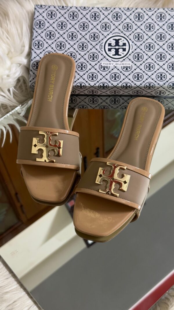 Buy Tory Burch flat slippers for women in Pakistan. Sizes 36–42 available. Premium packaging with brand box. Price Rs. 3200. Shop online at Shop2Door now!