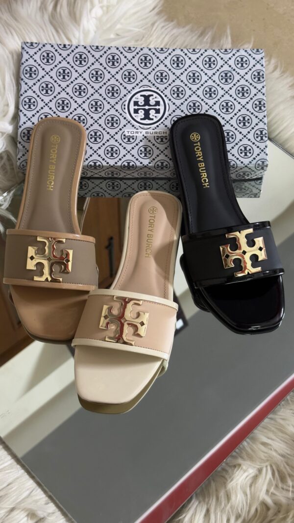 Buy Tory Burch flat slippers for women in Pakistan. Sizes 36–42 available. Premium packaging with brand box. Price Rs. 3200. Shop online at Shop2Door now!