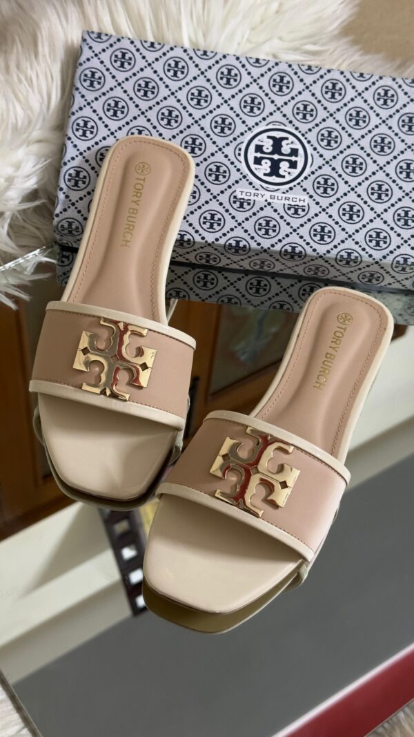 Buy Tory Burch flat slippers for women in Pakistan. Sizes 36–42 available. Premium packaging with brand box. Price Rs. 3200. Shop online at Shop2Door now!