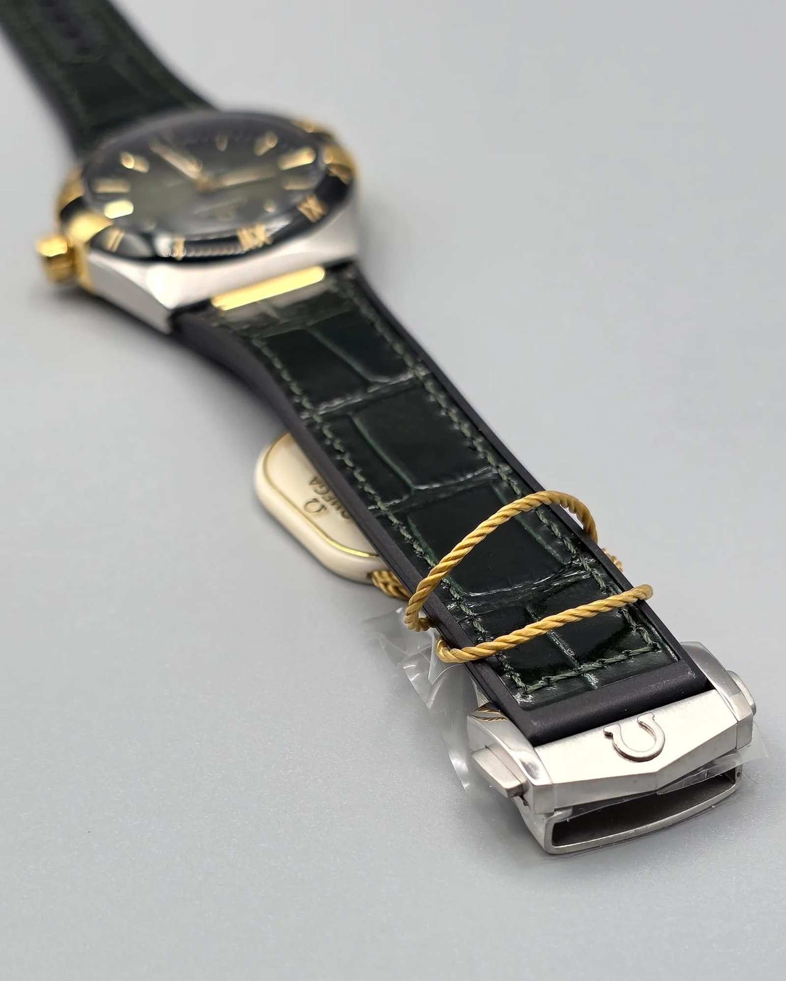 Omega Luxury Silver & Gold Watch – Black Bezel, Rubber Strap watch in Pakistan