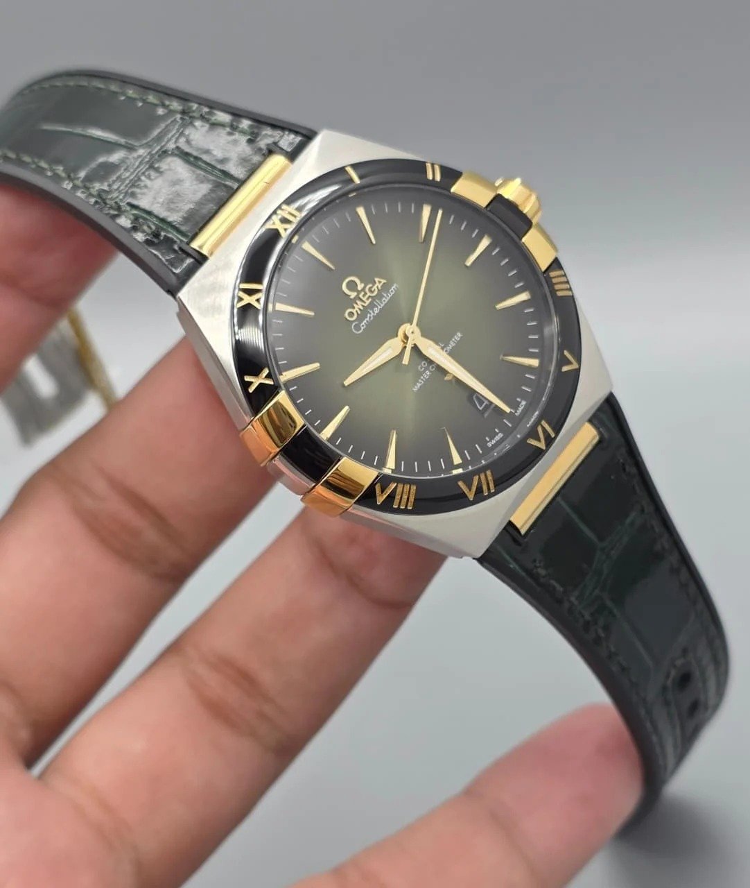 Omega Luxury Silver & Gold Watch – Black Bezel, Rubber Strap watch in Pakistan